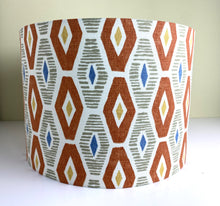 Load image into Gallery viewer, Drum Lampshade. Geometric orange, grey and blue graphic fabric print handrolled lampshade in 3 sizes
